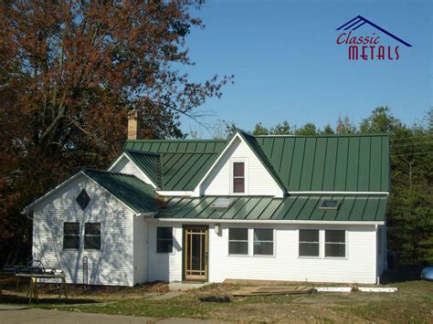 average cost of metal roof on ranch house|farmhouse with green metal roof.